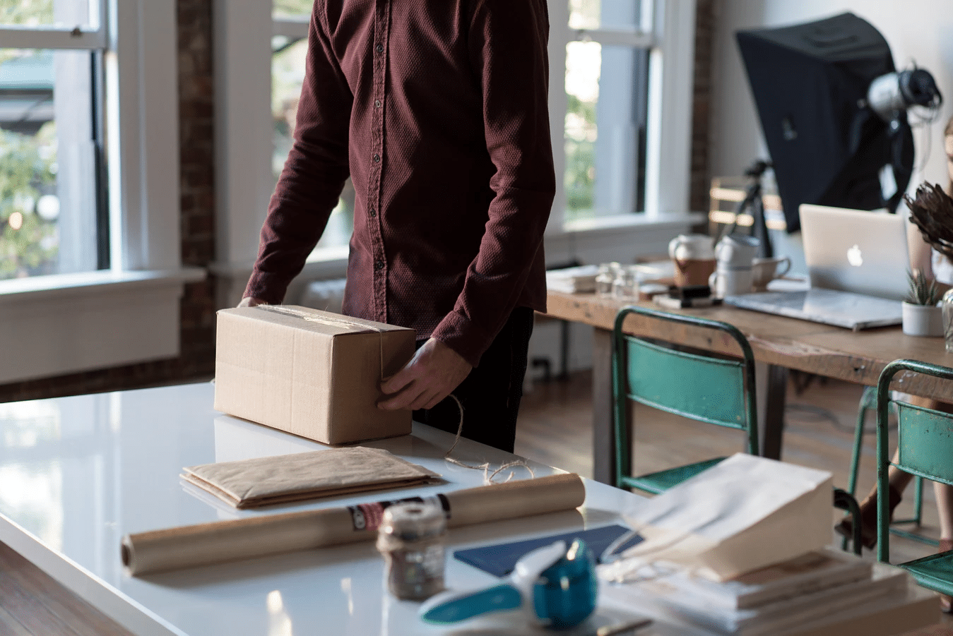 Person preparing package for shipment